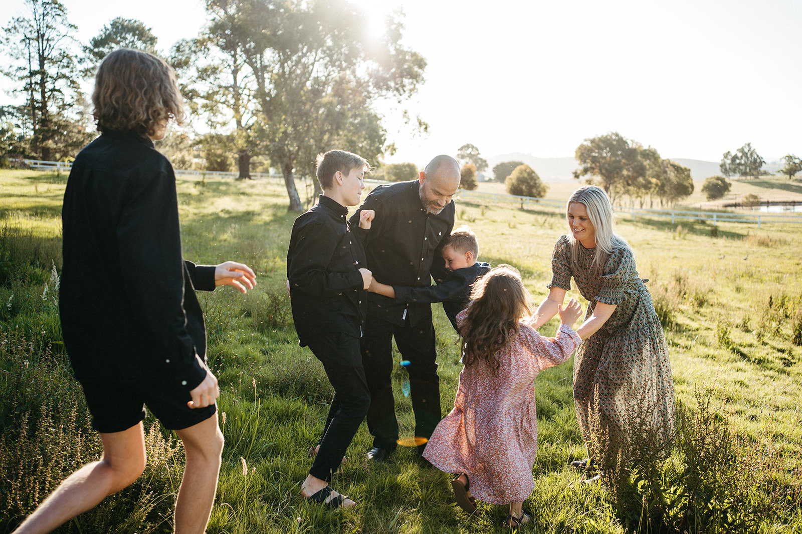 a playful documentary family image where children running at their parents