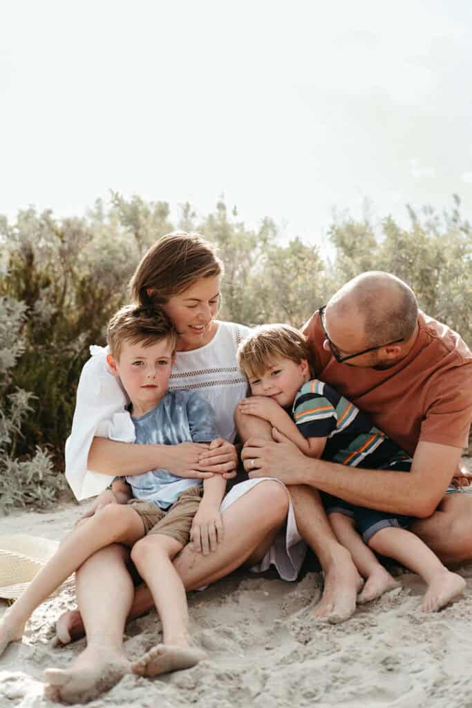 a family hug on williamstown beach