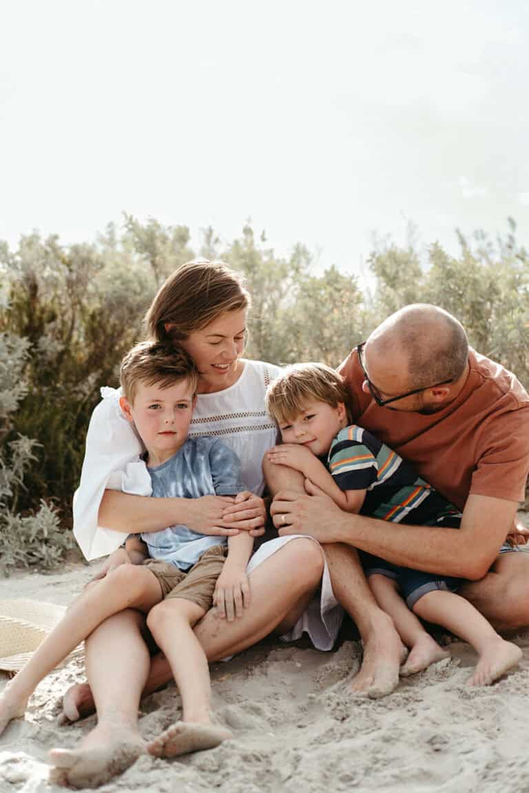 a family hug on williamstown beach