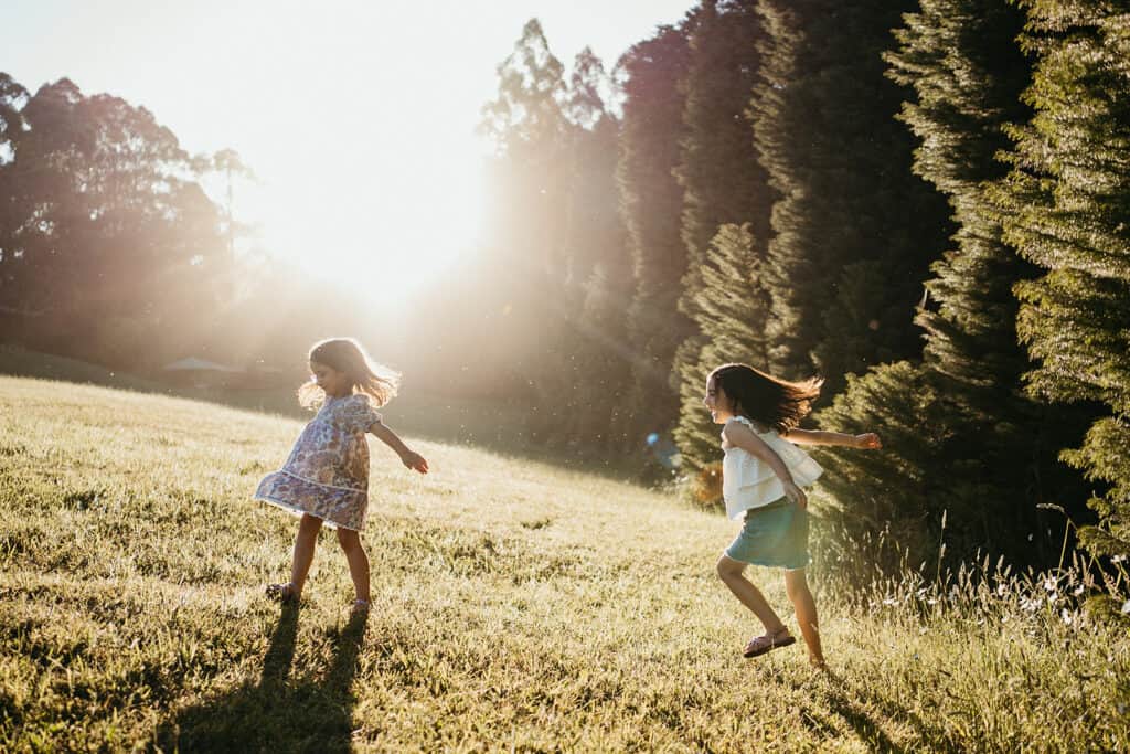 girls dance in sunlight