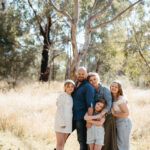a family with three girls in bushland near templestowe