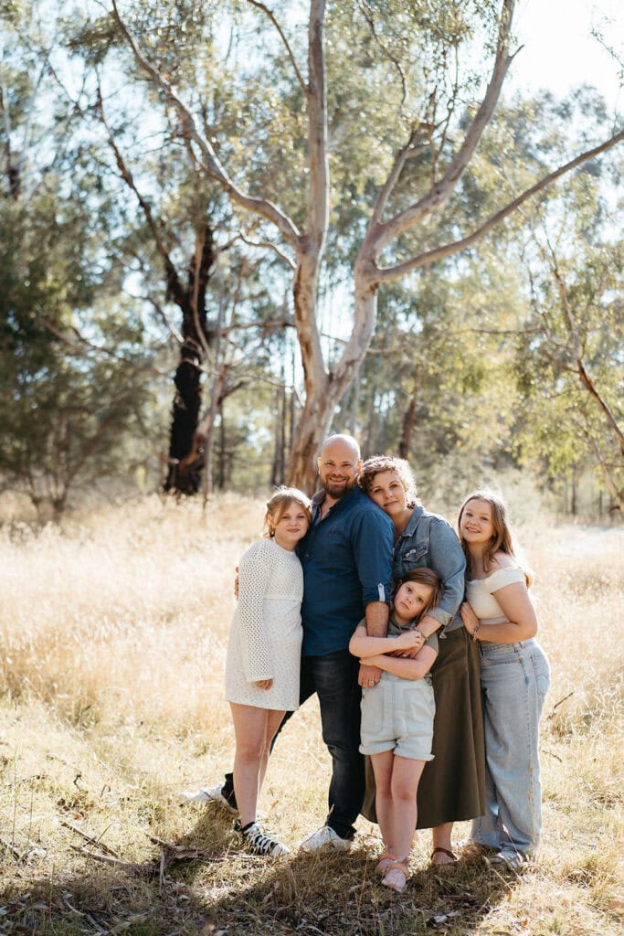 a family with three girls in bushland near templestowe
