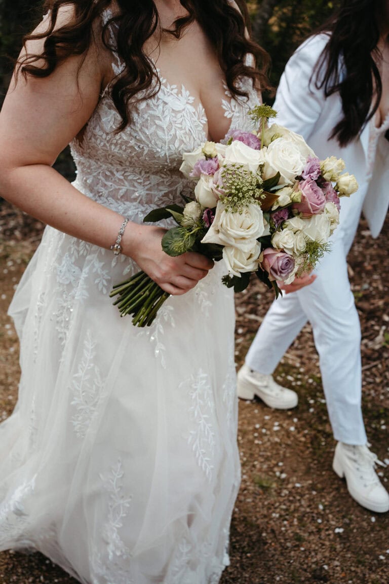 a purple and white bridal bouquet by Gisborne Florist