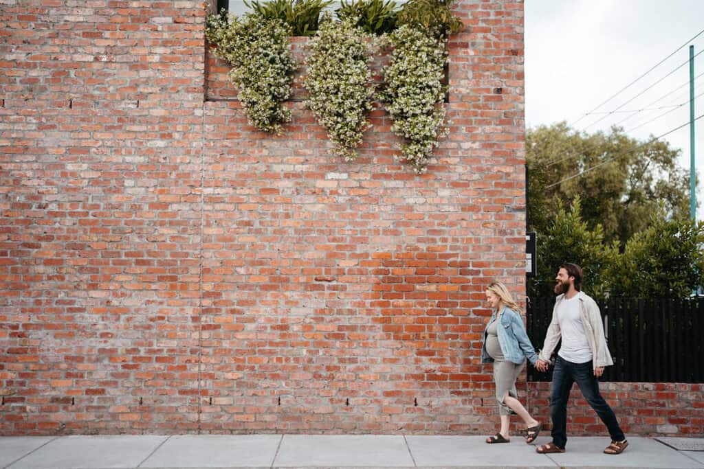 a couple walk on a melbourne street