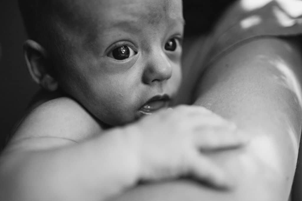 baby with wide open eyes during a melbourne newborn photography sesions