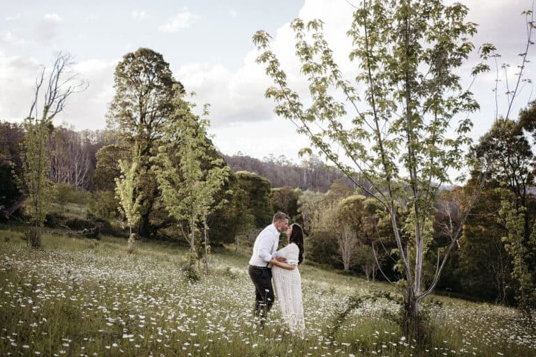 maternity photo at rj hamer aboretum in the daisies
